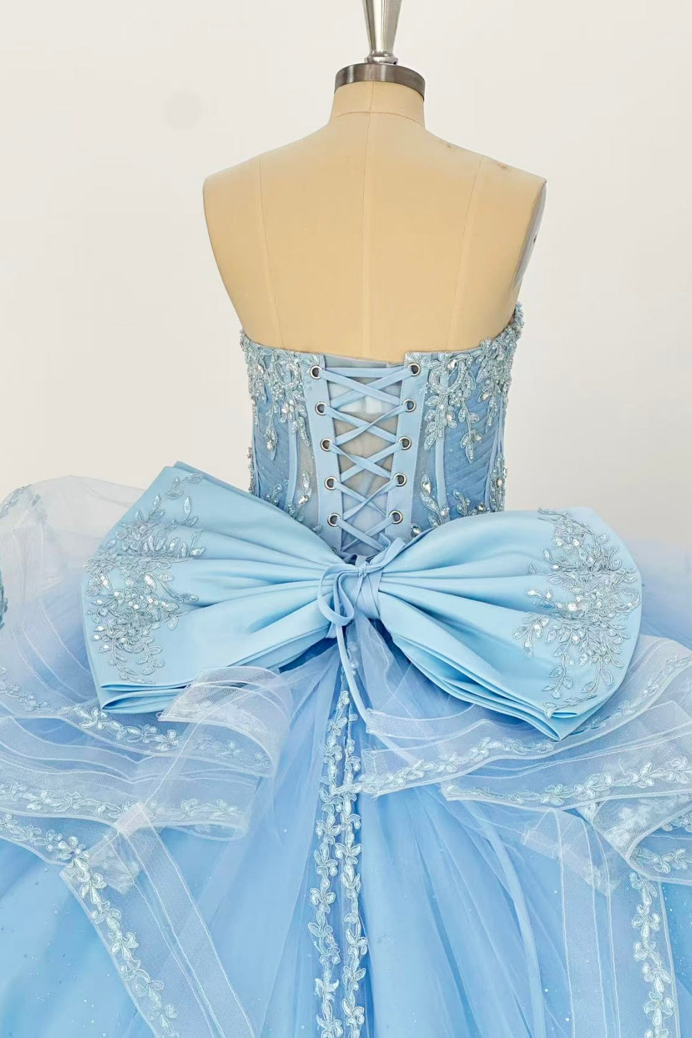 Sweetheart Sleeveless Beaded Appliques Ruffles Tiered Bow Knot Baby Blue Quinceañera Dress Y1016