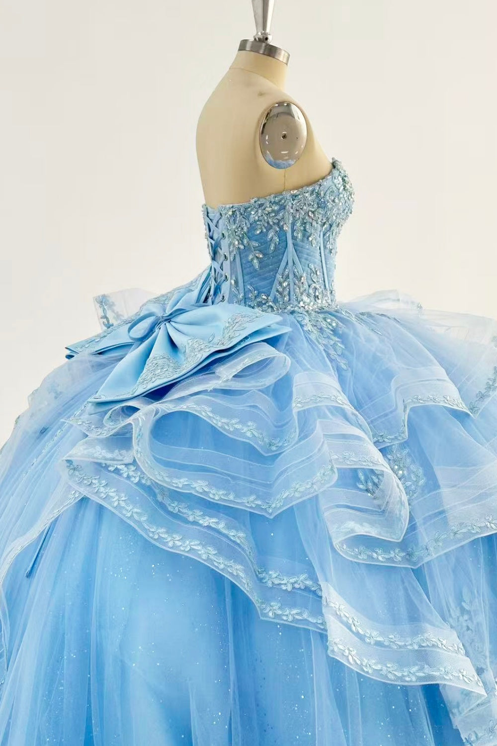 Sweetheart Sleeveless Beaded Appliques Ruffles Tiered Bow Knot Baby Blue Quinceañera Dress Y1016