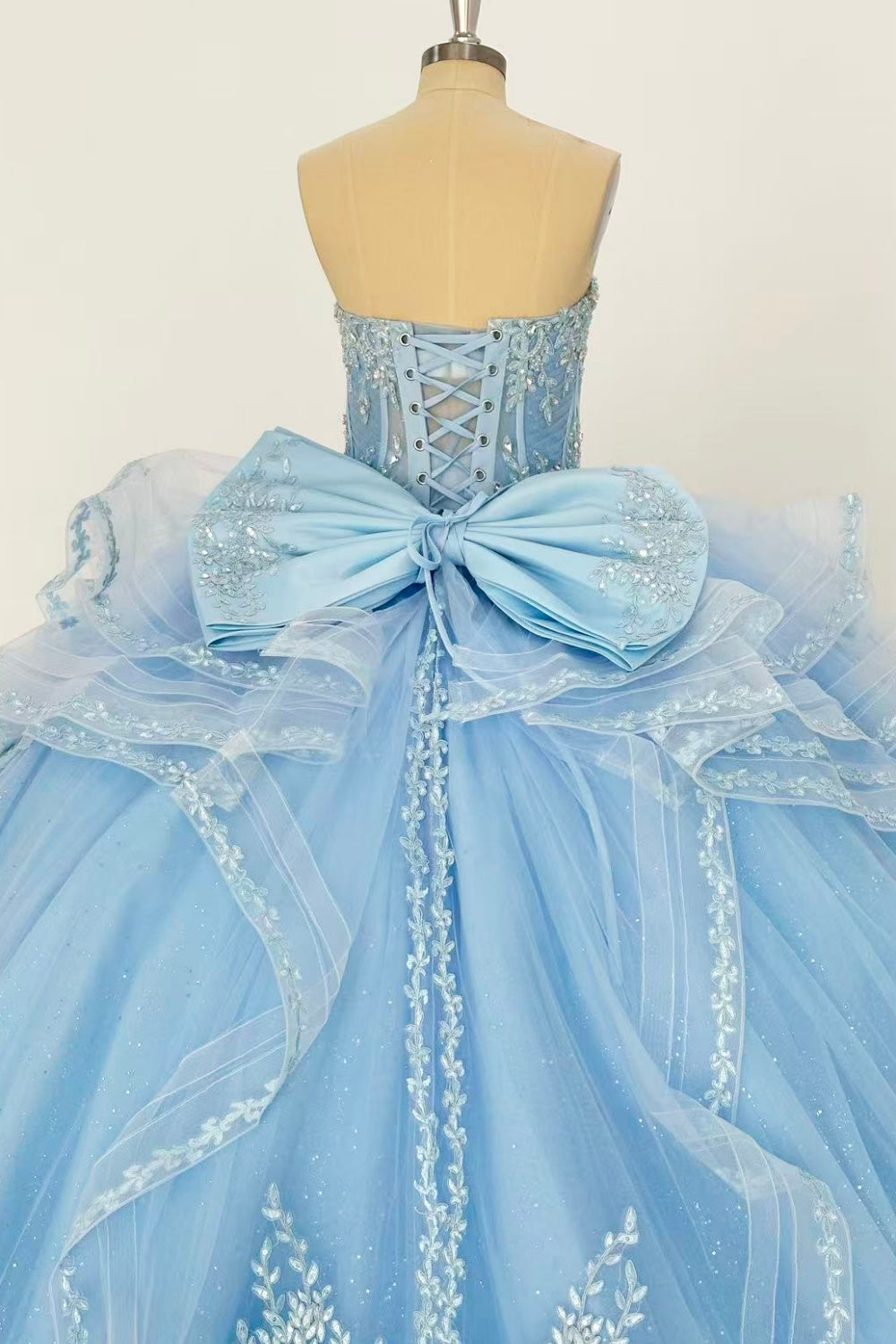 Sweetheart Sleeveless Beaded Appliques Ruffles Tiered Bow Knot Baby Blue Quinceañera Dress Y1016